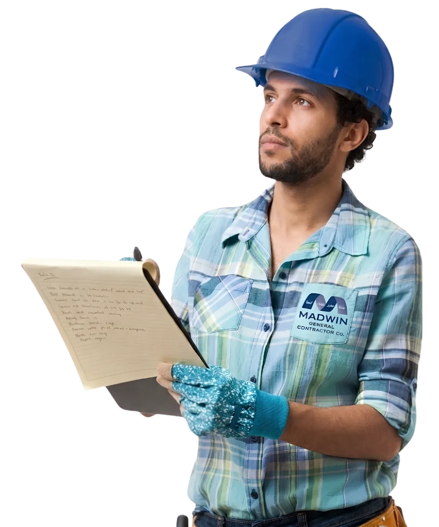 Madwin site engineer reviewing works on a clipboard